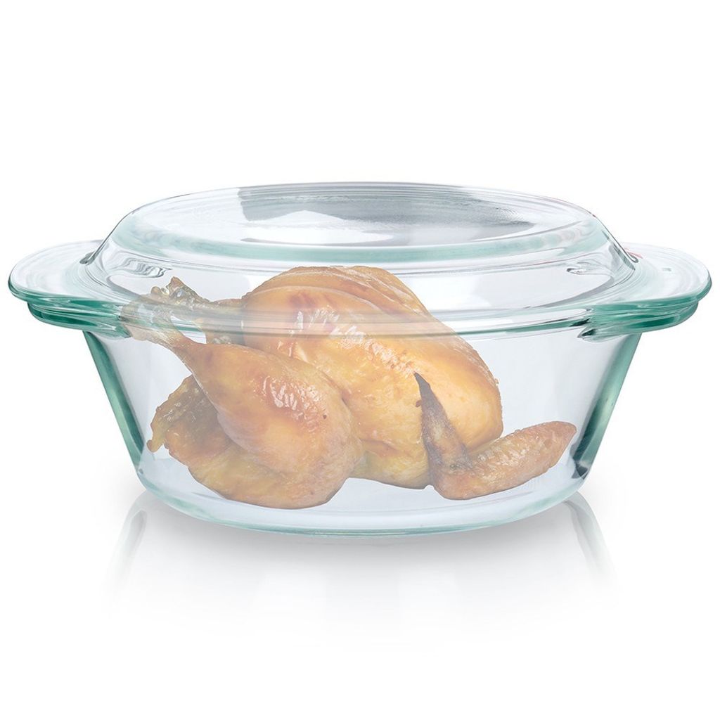 A roasted chicken in a glass baking dish.