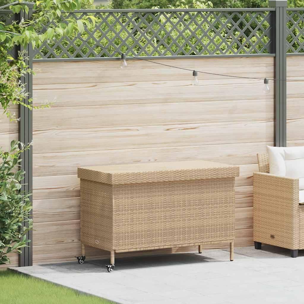 A beige poly rattan garden chest with wheels is placed on a patio next to a wooden fence.