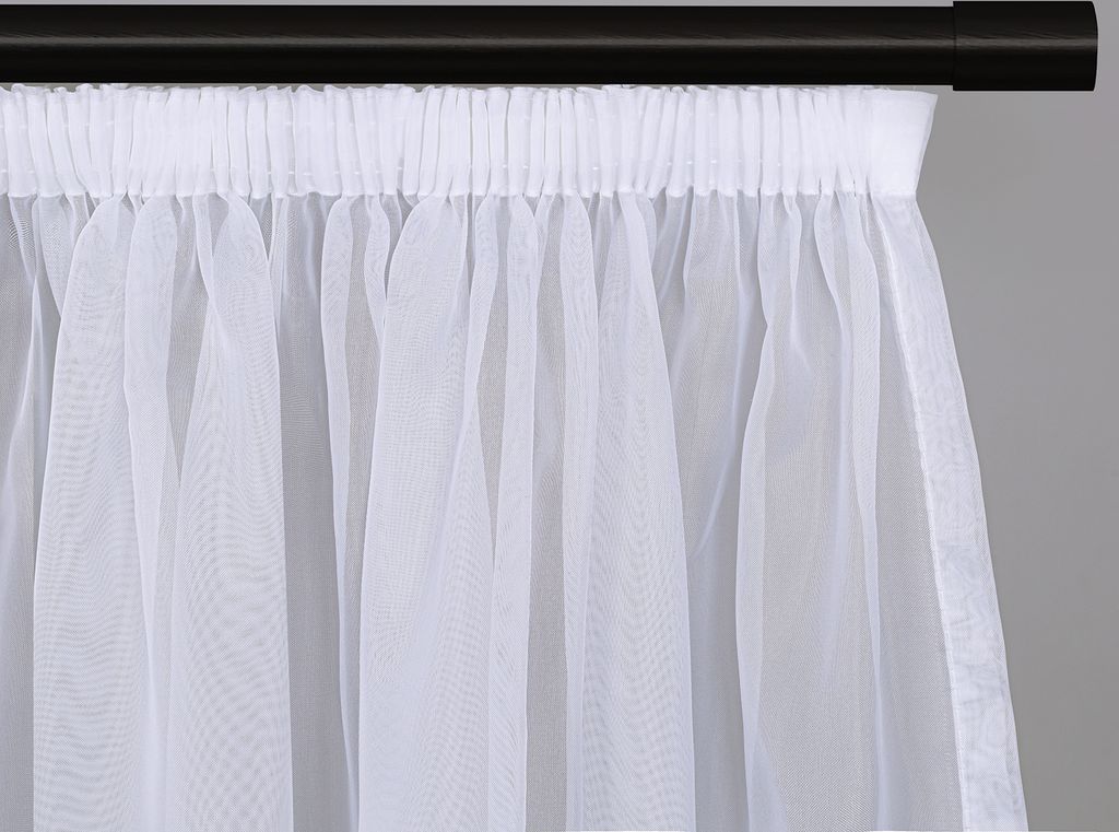 A close-up view of a white sheer curtain hanging from a black curtain rod.