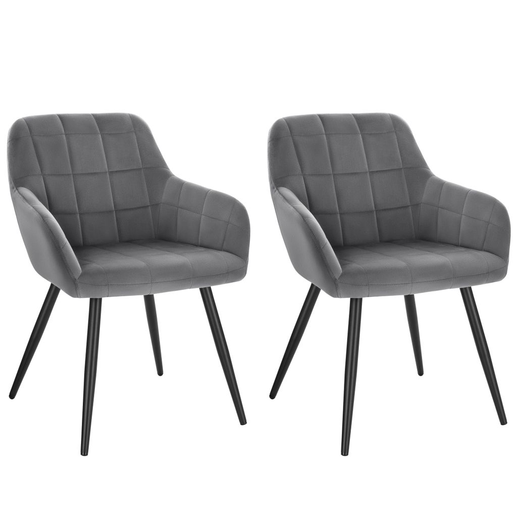 Two dark gray velvet chairs with black metal legs are shown against a white background.
