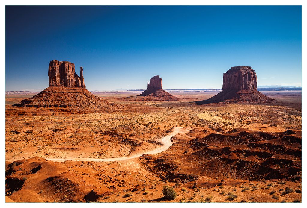 Wallario Küchenrückwand aus Glas, Größe: 90 x 60 cm, Motiv: Monument Valley unter blauem Himmel | Spritzschutz | abwischbar | pflegeleicht | in