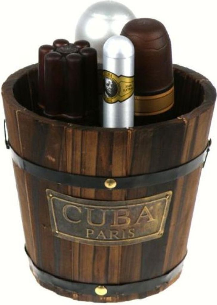 A wooden bucket filled with various items, including what appears to be cologne bottles and other gift items.