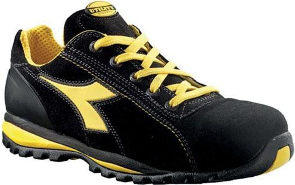 A single black and yellow work shoe is shown against a white background.