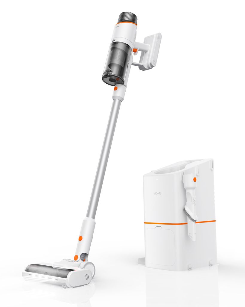 A cordless vacuum cleaner with its charging and dust collection station, presented in a studio setting.