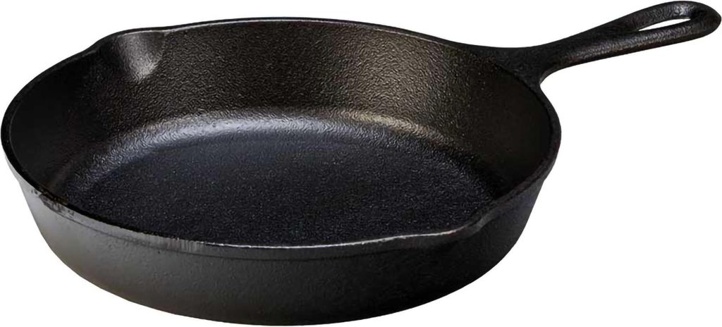 A black cast iron frying pan is shown from a slightly elevated side angle against a white background.
