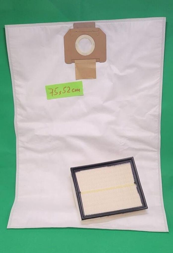 A white vacuum cleaner bag and a filter are laid out on a green background.