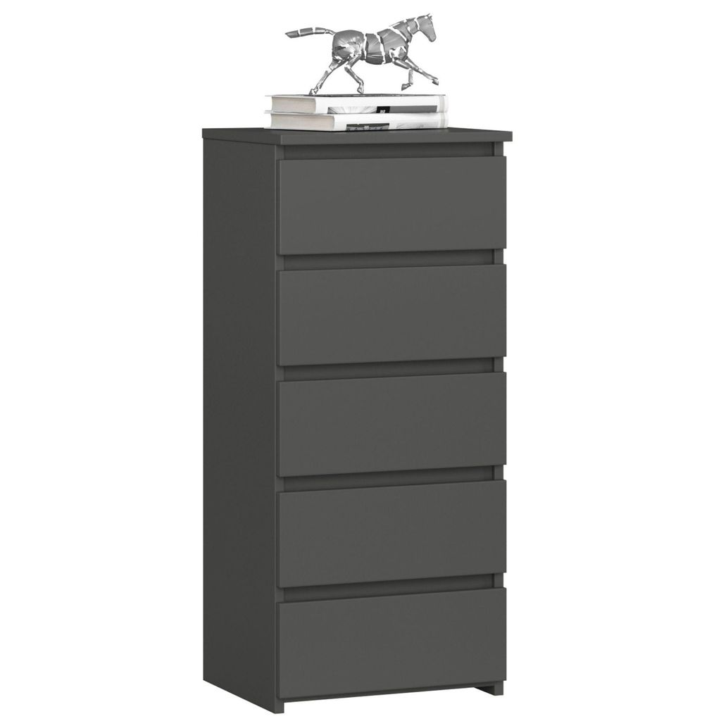 A gray chest of drawers with five drawers, topped with two books and a decorative horse figurine.
