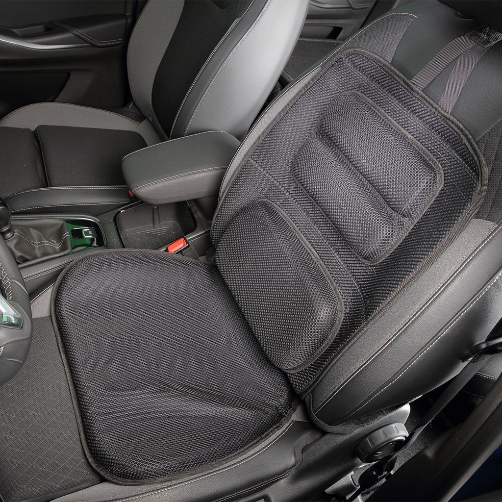 A black mesh seat cushion is placed on a car seat.