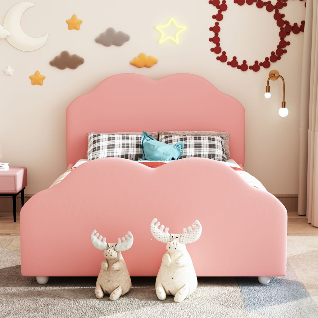 A child's bedroom with a pink cloud-shaped bed.