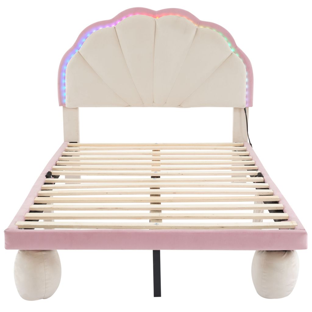 A bed frame with a shell-shaped headboard and LED lights.