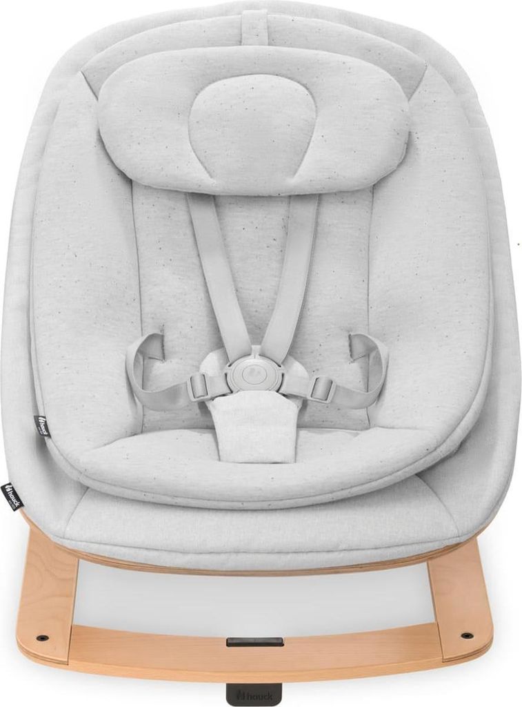 A baby bouncer seat with a wooden base.