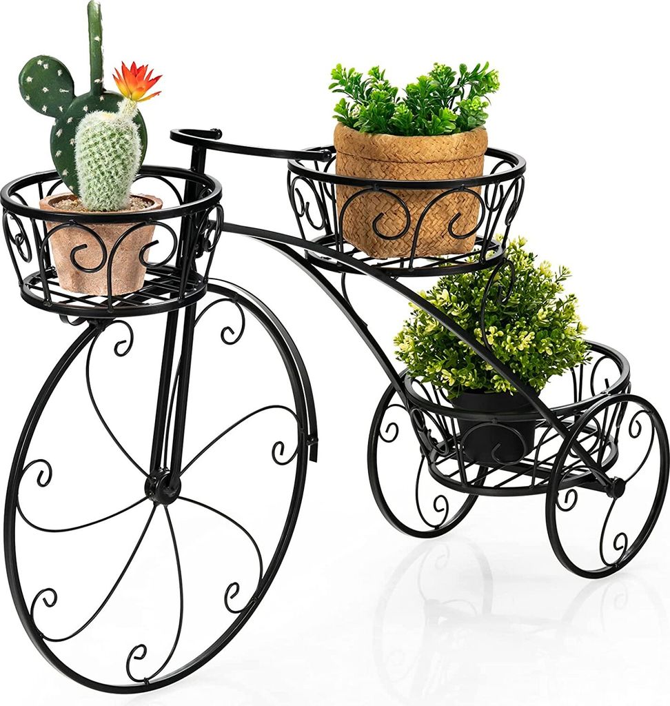A black metal plant stand shaped like a bicycle, holding three potted plants.