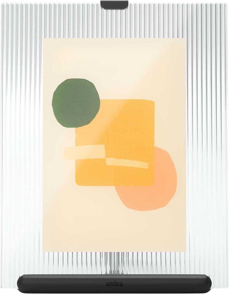 A framed artwork is displayed on a ribbed white background.
