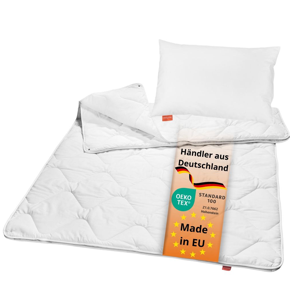 A white children's bedding set including a pillow and a duvet, with a tag showing product information.
