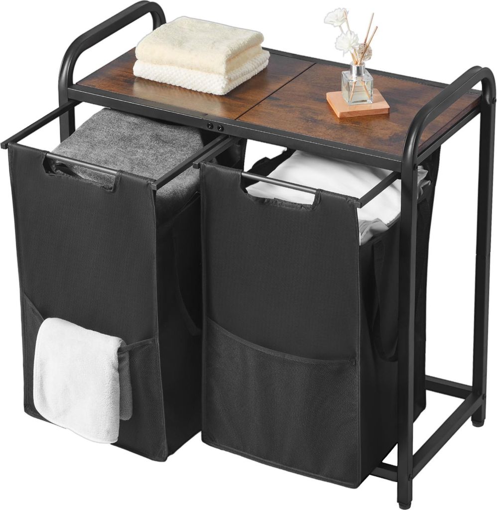 A laundry sorter with two black fabric bins and a wooden top shelf, placed on a white background.