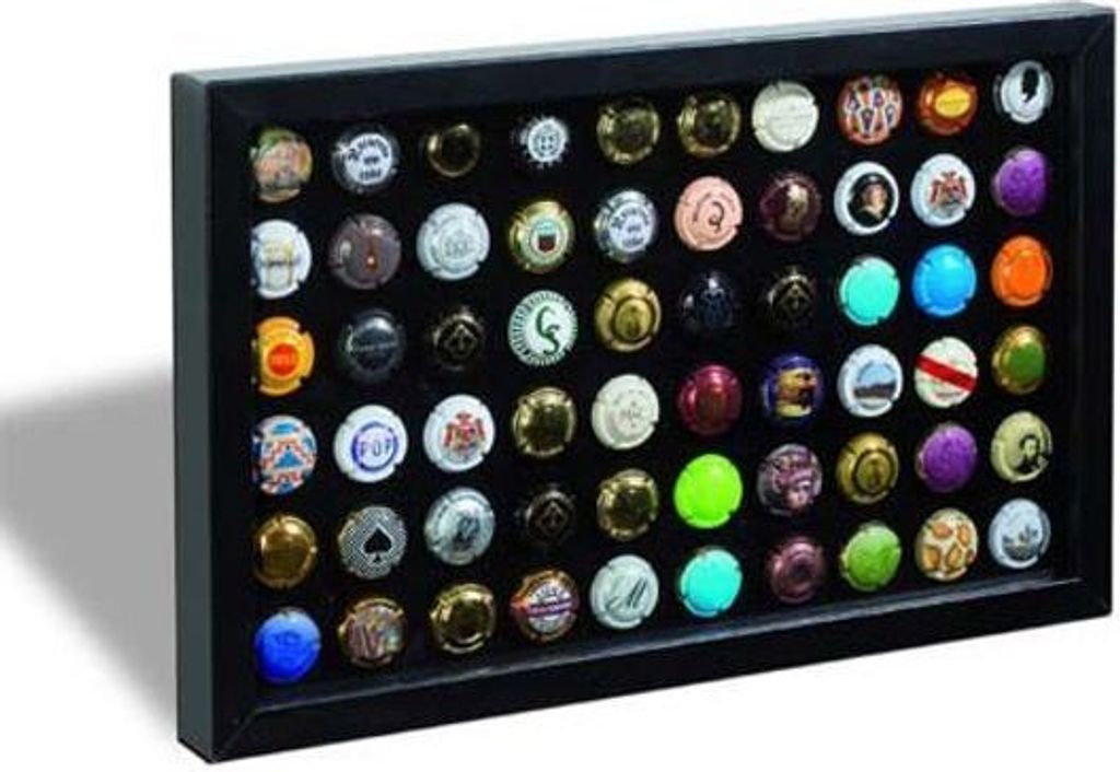 A display frame filled with many different champagne caps.