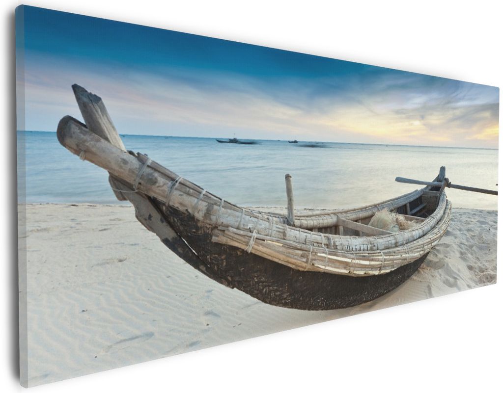 Wallario Premium Leinwandbild Fischerboot am Strand mit Sonnenuntergang in Größe 30 x 75 cm