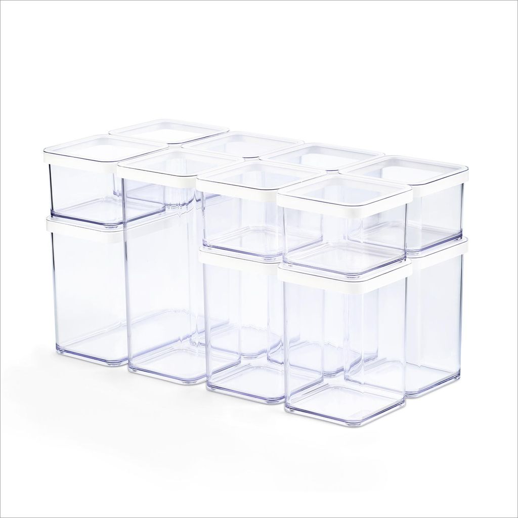 A set of clear plastic food storage containers with white lids, arranged in a grid on a white background.