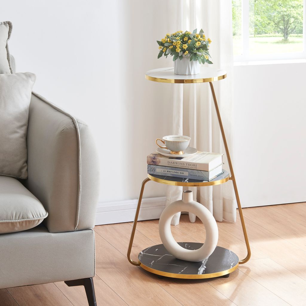A side table with decorative items next to a sofa.