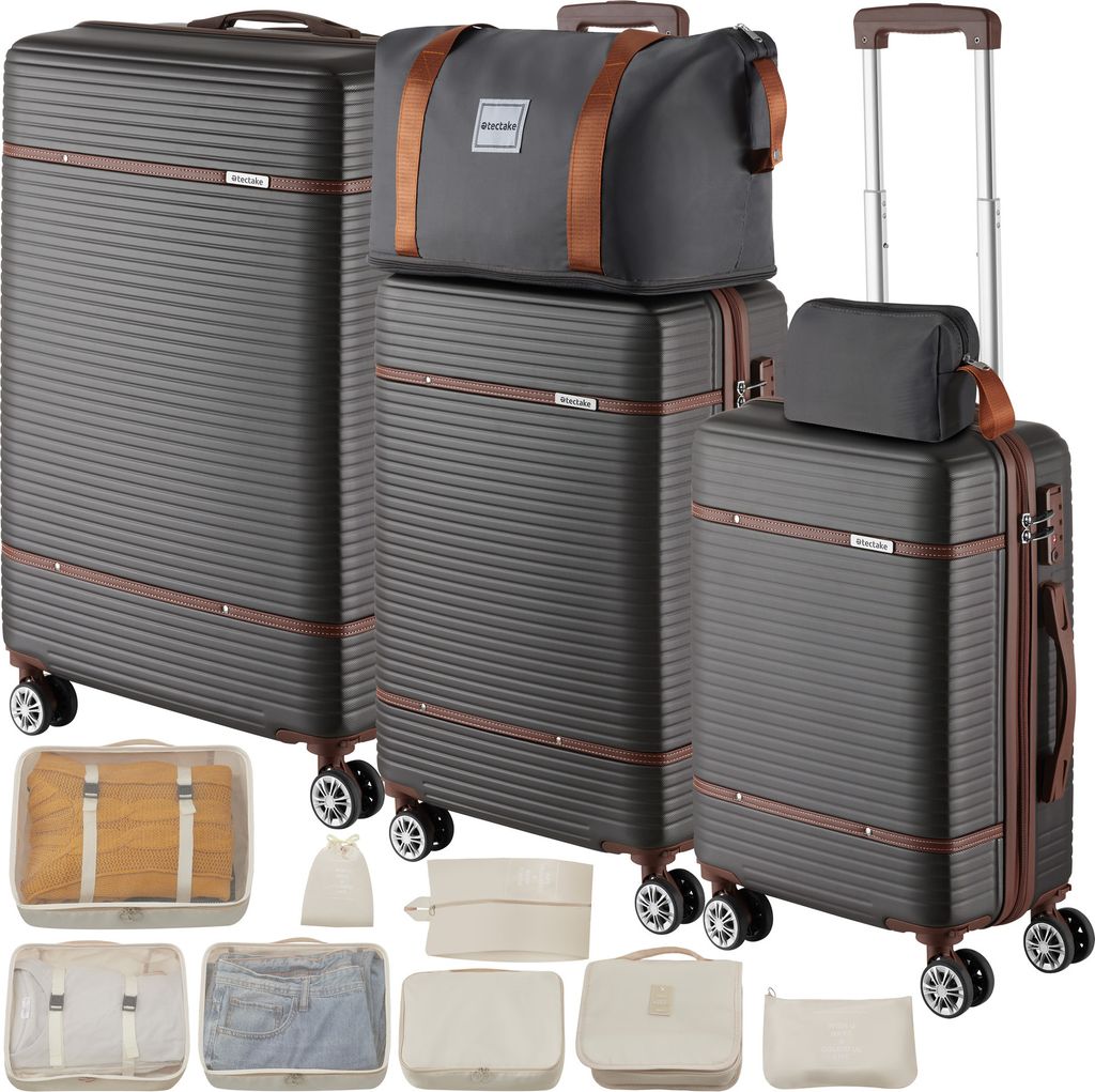 A set of luggage and packing cubes arranged on a white background.