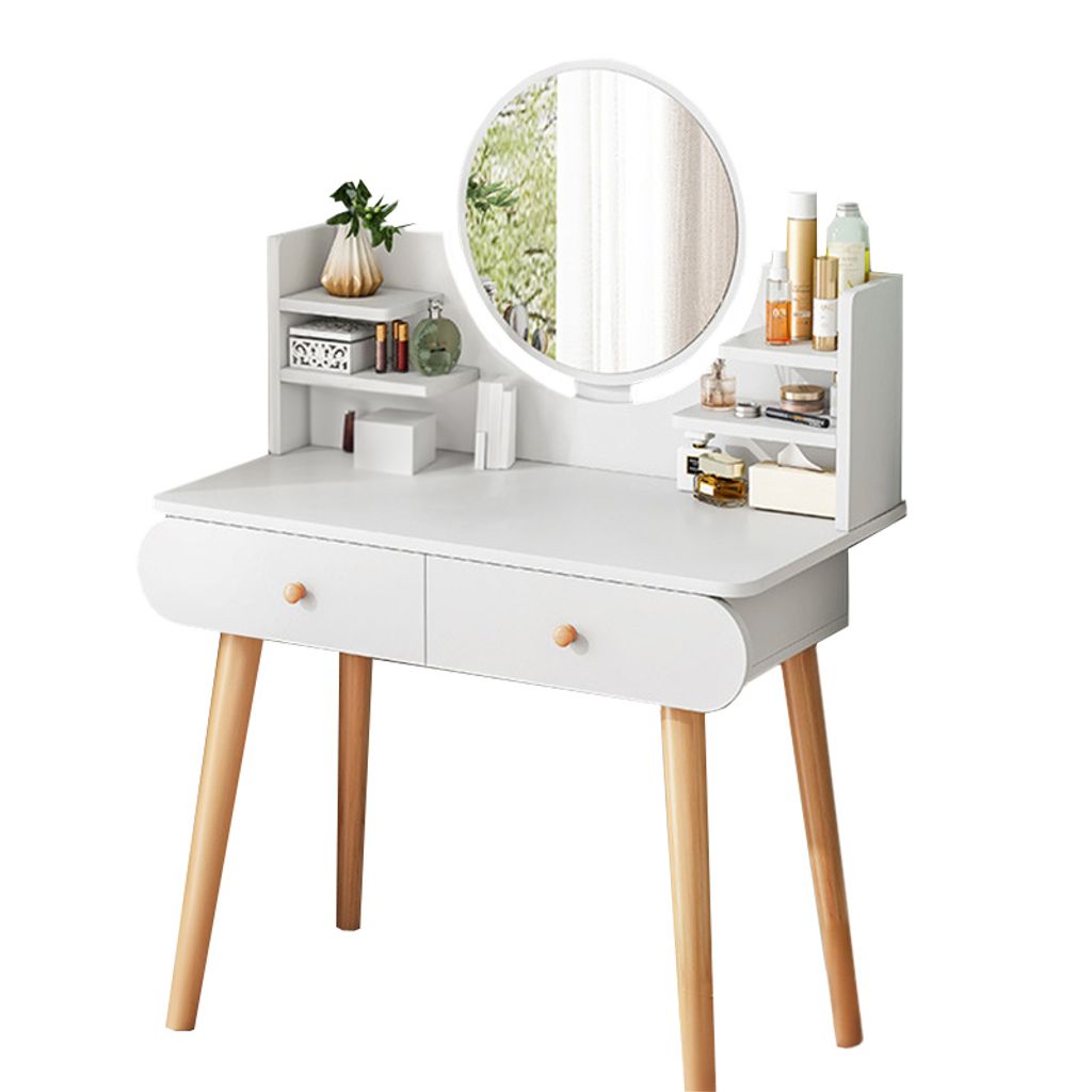 A white vanity table with wooden legs, featuring a round mirror and shelves stocked with various cosmetic products.