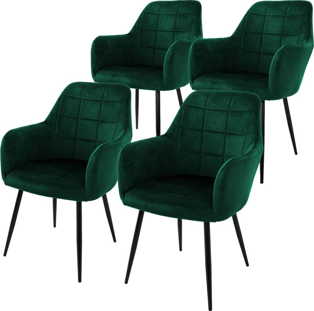 Four dark green velvet dining chairs with black metal legs are arranged on a white background.