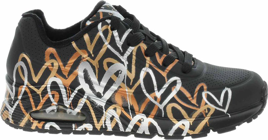 A side view of a black sneaker with a metallic heart pattern.