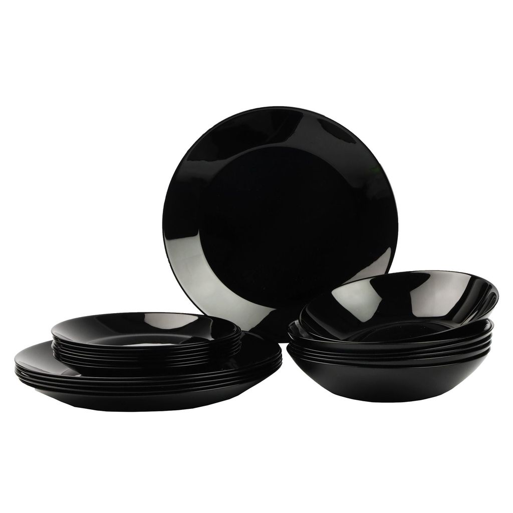 A set of black dinnerware, including plates and bowls, is neatly arranged against a white background.