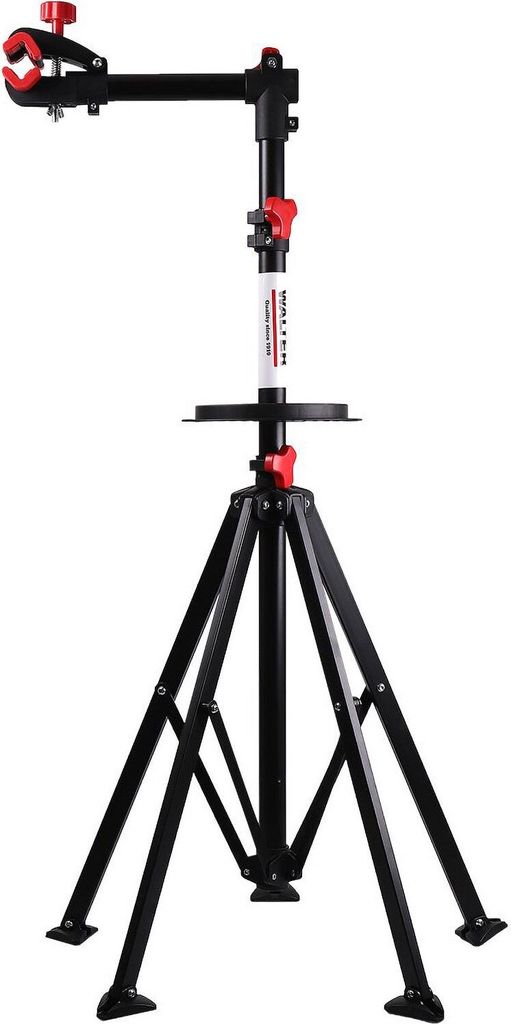 A black and red bicycle repair stand with a tripod base and a clamp for holding a bicycle frame.