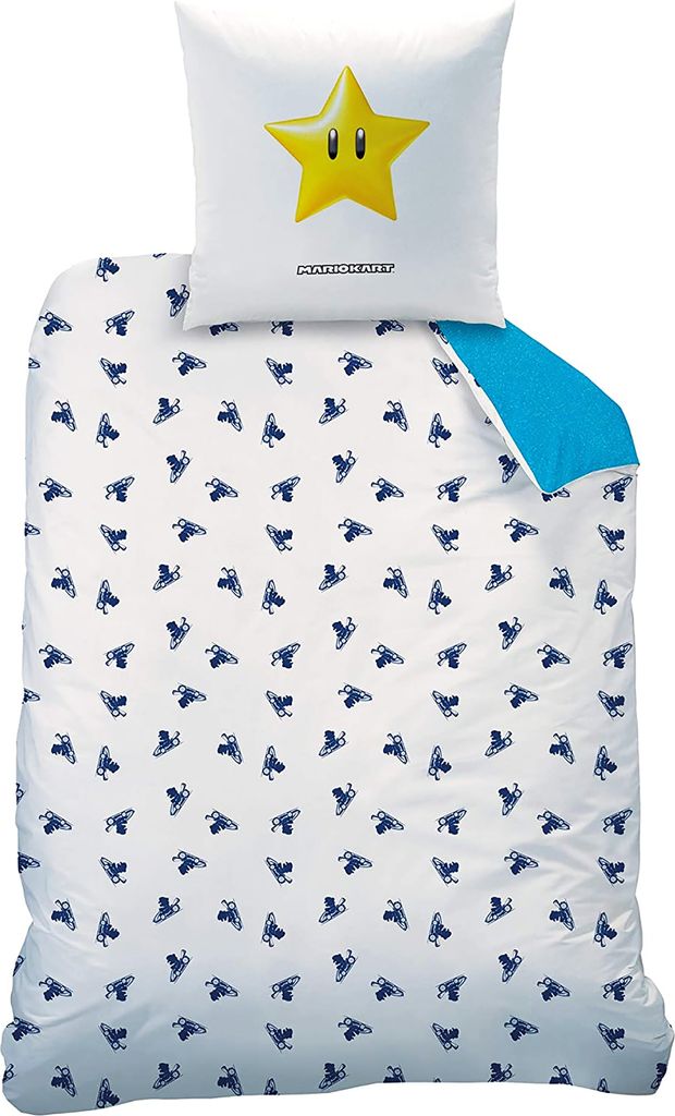 A white pillowcase with a yellow star and a white duvet cover with a repeating pattern of blue objects on a white background.