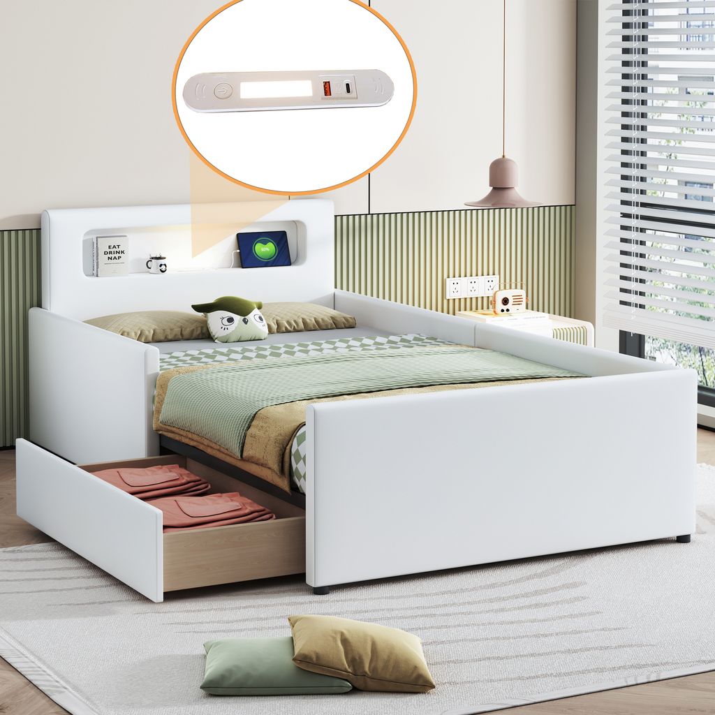 A white upholstered bed with a headboard featuring storage compartments and a built-in light. The bed has a pull-out drawer underneath, and is shown with pillows and bedding.