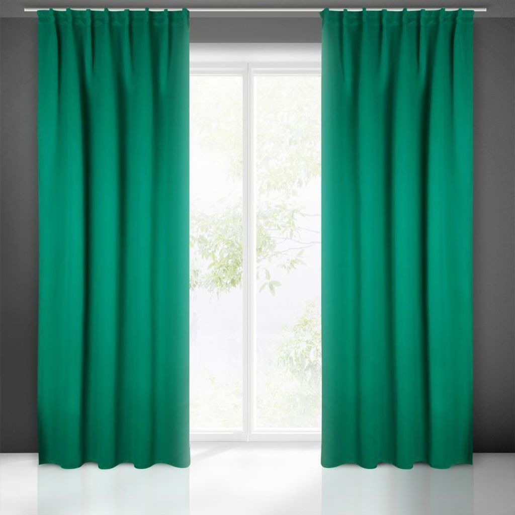 Two teal curtains are drawn open, revealing a window with trees visible outside. The curtains are hanging from a white rod.