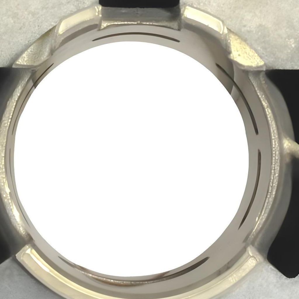 Close-up view of a metal cylinder component with black accents.
