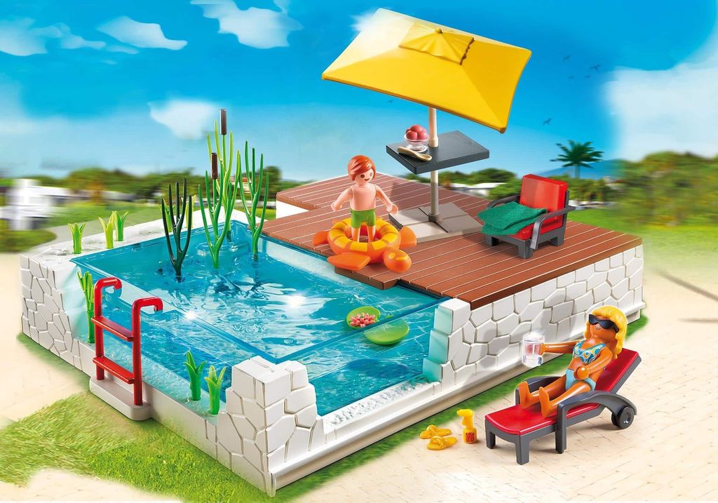 A Playmobil swimming pool set with figures enjoying the pool and sun.