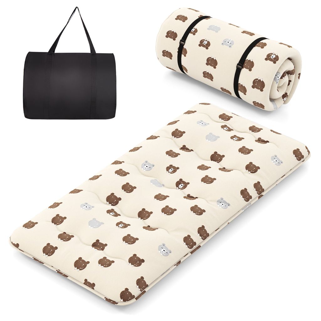 A black carrying bag and a rolled-up and unrolled mattress with a bear pattern are displayed against a white background.
