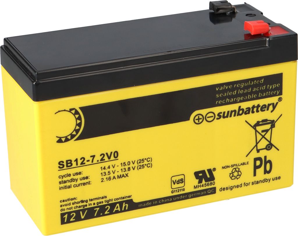A yellow and black battery with product information and logos printed on its side.