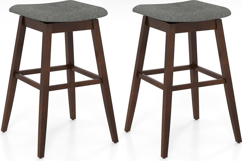 Two brown wooden bar stools with gray upholstered seats are shown against a white background.