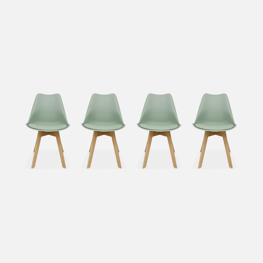 Four green chairs with wooden legs arranged in a row against a light gray and white background.