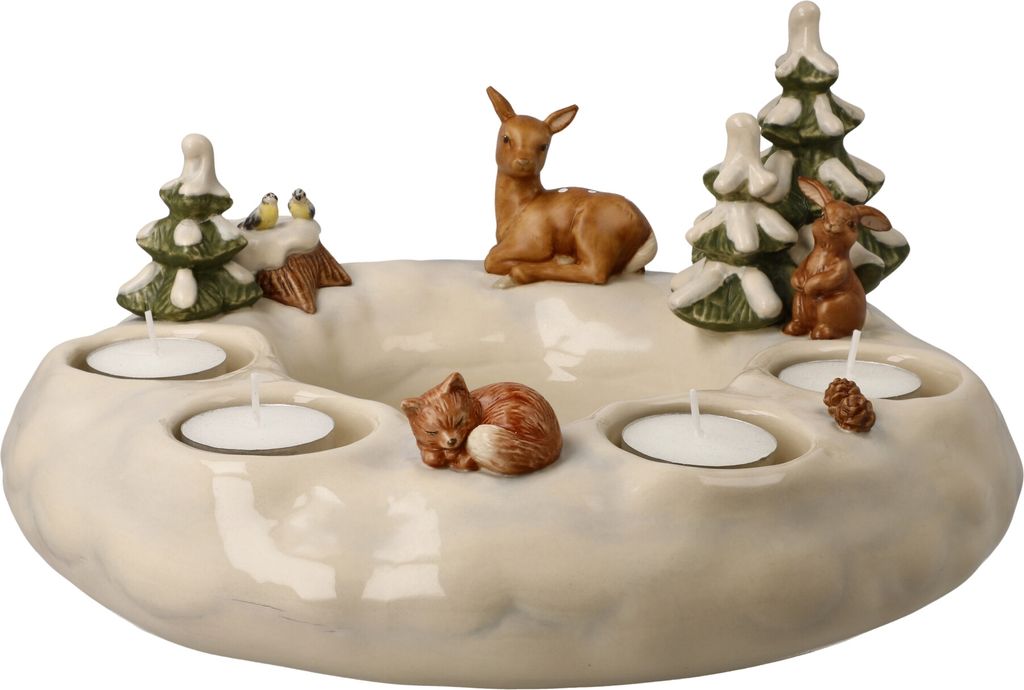 A ceramic advent wreath with winter-themed figurines and tea light holders.