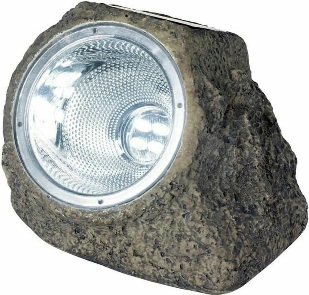 A solar-powered spotlight designed to look like a rock.