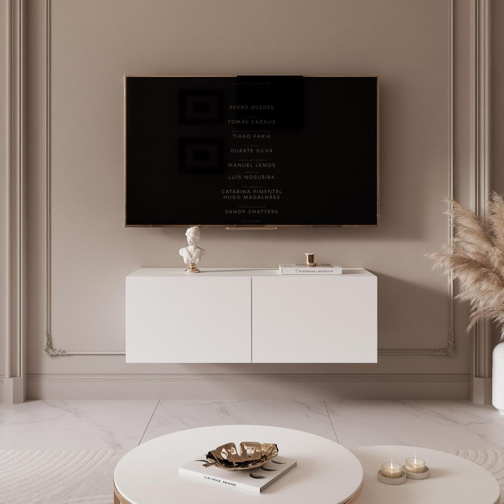 A modern living room with a wall-mounted TV and a white lowboard.