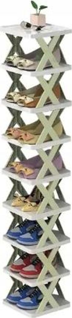 A multi-tiered shoe organizer with shoes on each shelf, topped with a small potted plant.