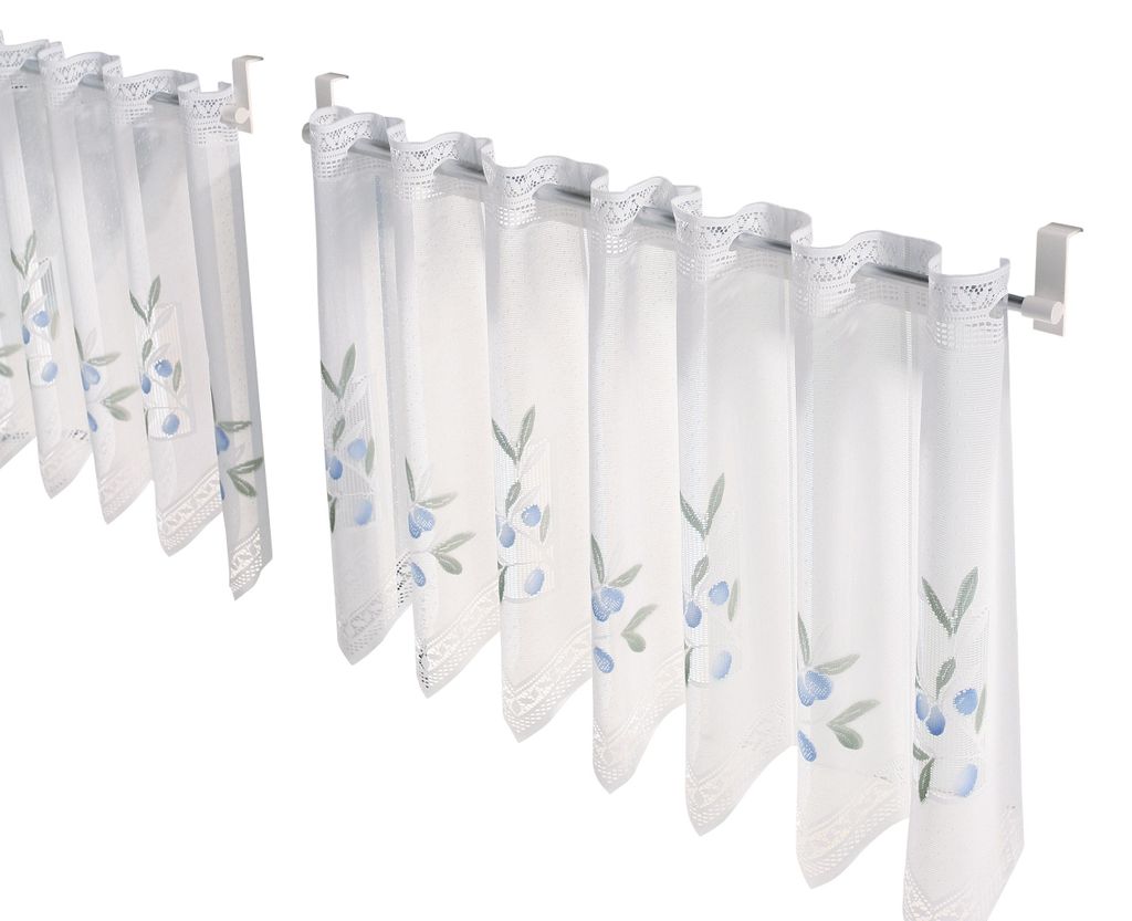 Two sets of cafe curtains with a blue floral pattern hanging on curtain rods.