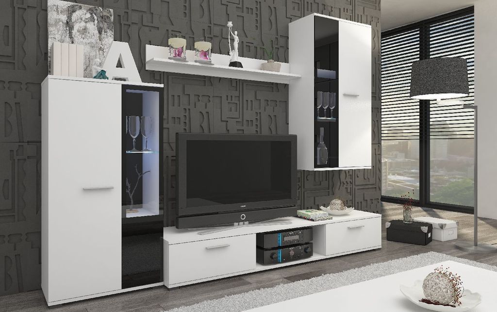 A modern living room display unit with a TV, shelves, and cabinets.