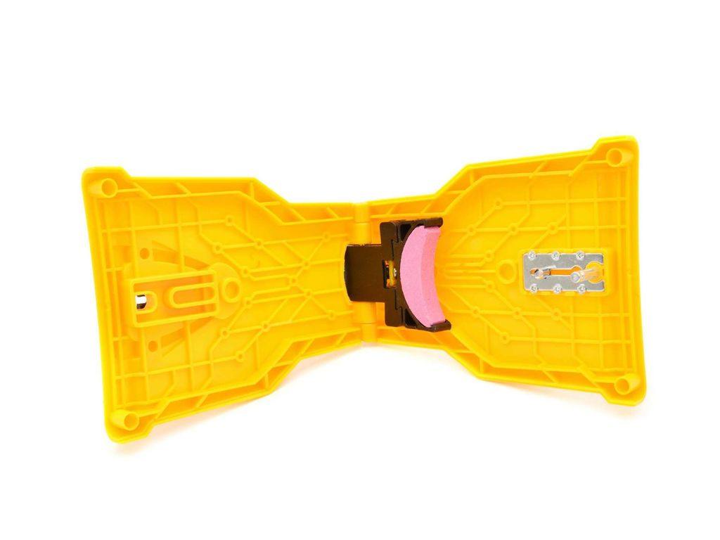 The image shows the underside of a yellow chainsaw sharpener on a white background.