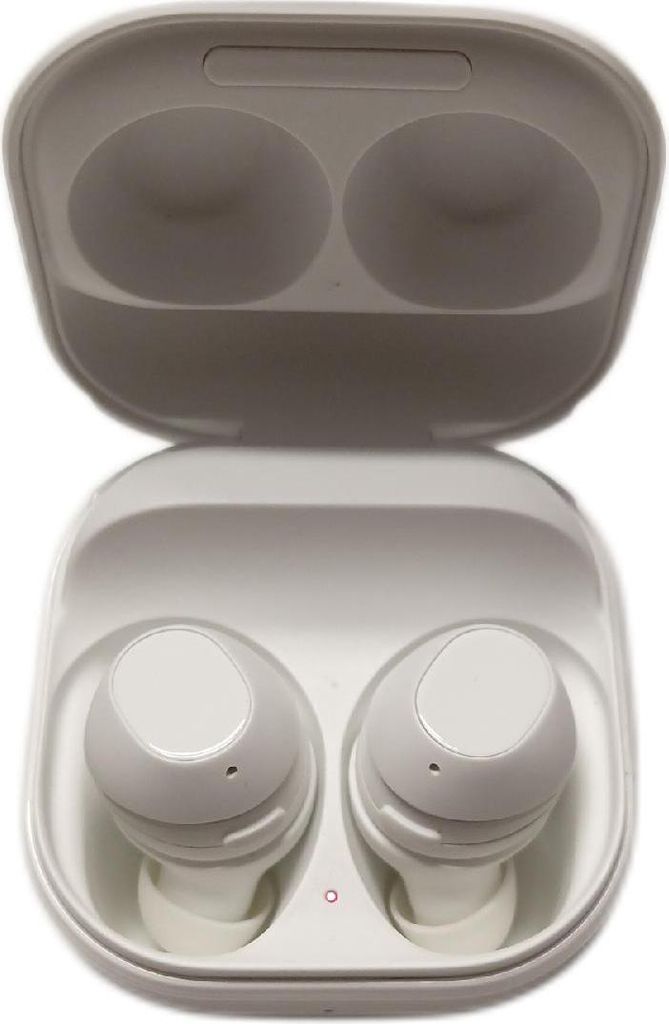 A pair of white wireless earbuds in their charging case.