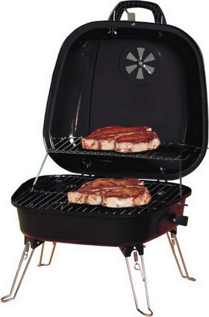 A black portable grill with two steaks on the cooking grates, shown with its lid open and legs extended.