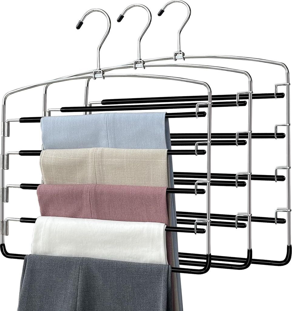 A multi-tiered hanger with several pairs of pants folded over it.