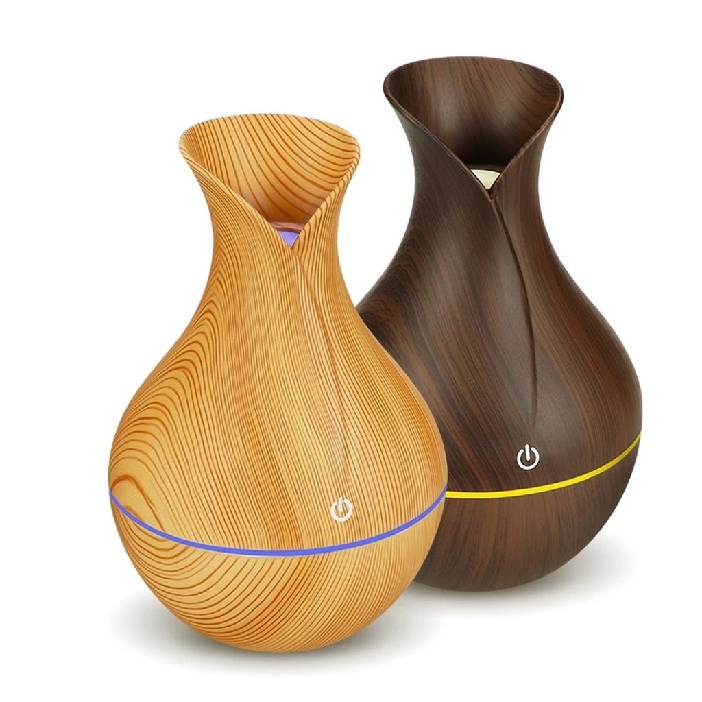 Two aroma diffusers with a wood grain finish are displayed against a white background.