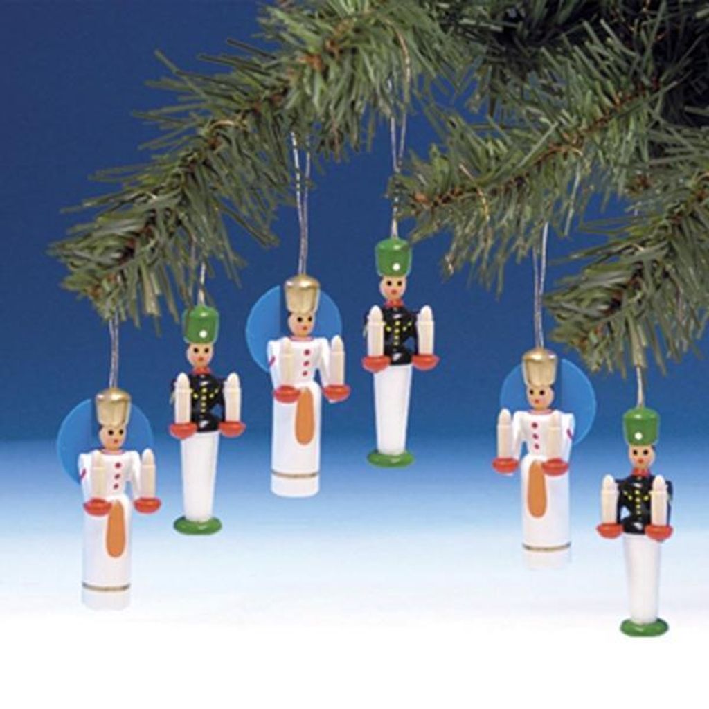 Christmas tree ornaments hanging from a branch.